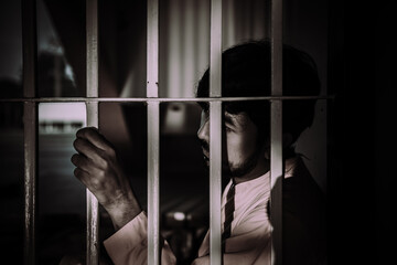 Hands of men desperate to catch the iron prison,prisoner concept,thailand people,Hope to be free.