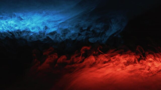 Color smoke background. Hot cold. Blue red glowing steam motion on black.