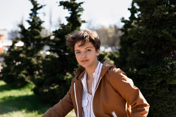 Portrait of a young woman with a short haircut.