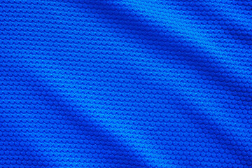 Blue football jersey clothing fabric texture sports wear background, close up top view