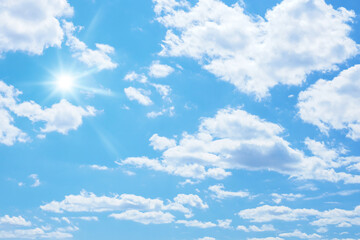 blue sky with sun and clouds background