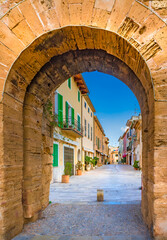 Fototapeta na wymiar Medieval archway of fortification wall in Alcudia on Majorca, Spain