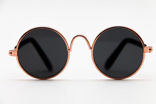 Round Sunglasses Close-up On A White Background