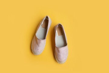 Various women's shoes on a colored background, top view. Top view, flat lay. Beauty blog concept.