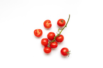 Sprig of ripe fresh cherry tomato on a white background, top view, flat lay