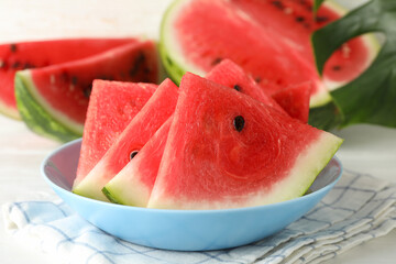 Composition with plate of fresh watermelon on white wooden background