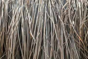 Background from dry grass. The roof is made of natural materials.