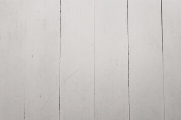 Flat view of a bunch of white painted wooden planks. taken inside under a bright artificial light.