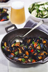 Mussels in black bean sauce with chilli and parsley