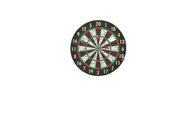 Obraz premium Close up view of dartboard with missiles on white background isolated. Sport and hobby concept.