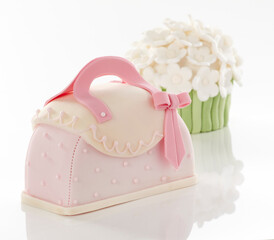 white cake with pink frosting