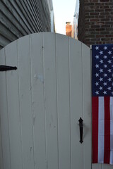 american flag on fence