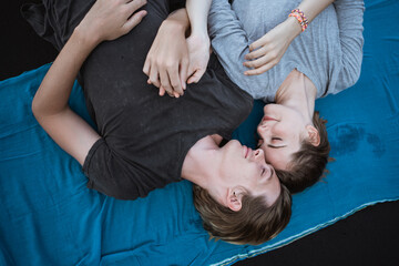 Young couple enjoy a trip together on the beach in the bright sunny day