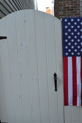 american flag on fence