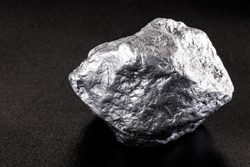 silver nugget native to Liberia isolated on black background. Rare stone for industrial extraction...
