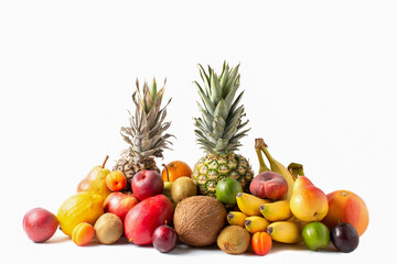 Tropical fruits assortment isolated on white background. Pineapples, coconut, bananas, mango, apples, kiwi, lime, lemon, pear, apricots, peaches and plum.