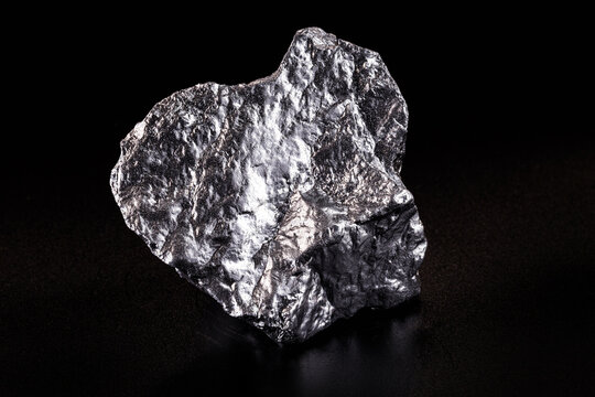 Chrome elemental specimen sample isolated on black background, mining and gemstone concept.