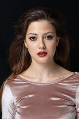 Naklejka premium Beauty portrait of a girl with makeup with red lips