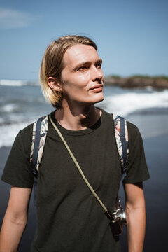 Male Photographer Candid On The Beach In The Bright Sunny Day