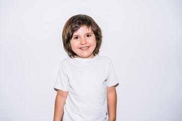 happy little boy smiling on a white background