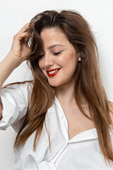 Beauty portrait of a girl with makeup with red lips