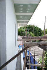 wooden scaffolding install use for high level for build ceiling .  concrete wall plaster cement on wall for building new house.