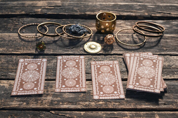 Tarot cards deck on the old wooden table background.