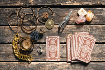 Tarot cards deck on the old wooden table background.