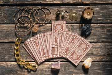 Tarot cards deck on the old wooden table background.