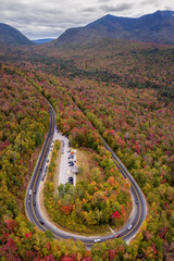 An aerial view of the hair pin turn on the Kancamagus Highway during autumn.