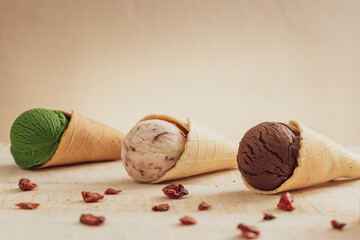 Scoops of ice cream on wooden background