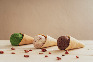 Scoops of ice cream on wooden background