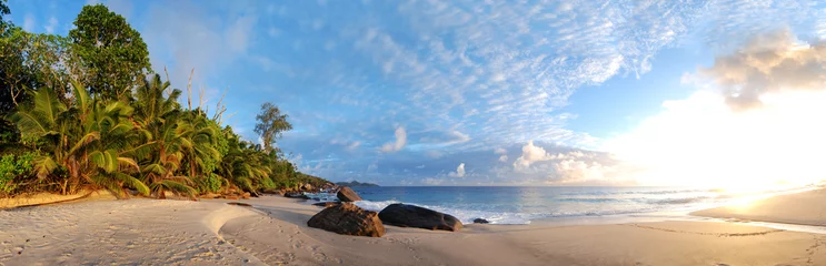 Tuinposter Seychelles beach like paradise with white sand and sunrise or sunset perfect travel and holiday location © MJ Fotografie