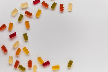 jelly bears on a white table scattered in a circle