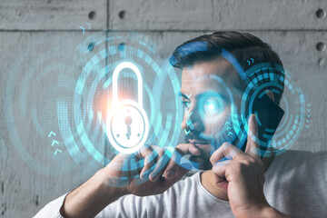 A man in casual wears, talking phone. Double exposure. LOCK icons drawings hologram. Security datum concept.