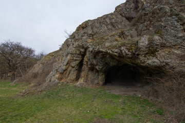 cave and a meadow in the nature