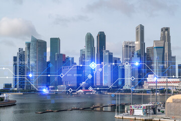 Technology hologram over panorama city view of Singapore. The largest tech hub in Asia. The concept...