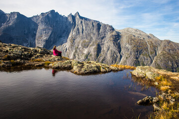A middle age woman enjoying some superb views of the Troll wall in Romsdal, Norway          




