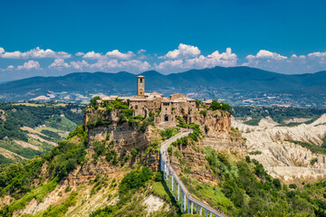 View of the medieval town of Civita di Bagnoregio, located on the top of a spur of tuff rock, in...