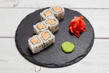 roll with salmon on a black slate