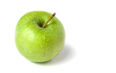Green apple on a white background. Selective focus.