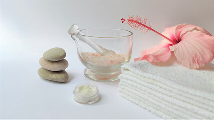 Spa setting and Spa background composition with hibiscus pink flower on white background. Banner. Copy space.