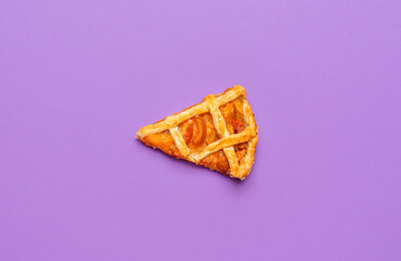 Slice of apricot pie on a purple background. Last piece of the pie