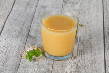 Dietary vegetarian oats milk over wooden