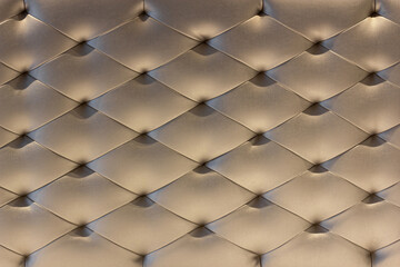 Pattern of Gold Leather Upholstery Sofa Background. Luxury Decoration Sofa