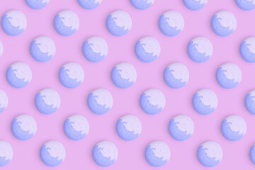 Macaroons pattern on colored background, a pattern of colorful french cookies macarons. Blue french cookies macarons on purple background. Gift for congratulations.