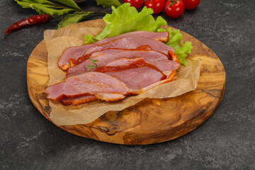 Sliced smoked duck breast served salad