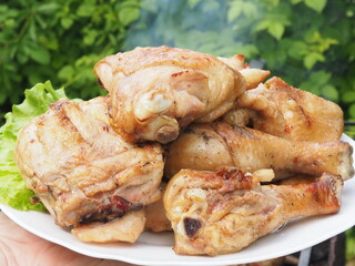 grilled delicious chicken on a plate. barbecues.