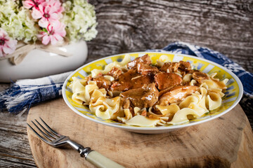 Pork stew served with noodles.
