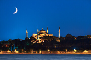 Hagia Sophia at night with crescent moon in the sky, Istanbul, Turkey